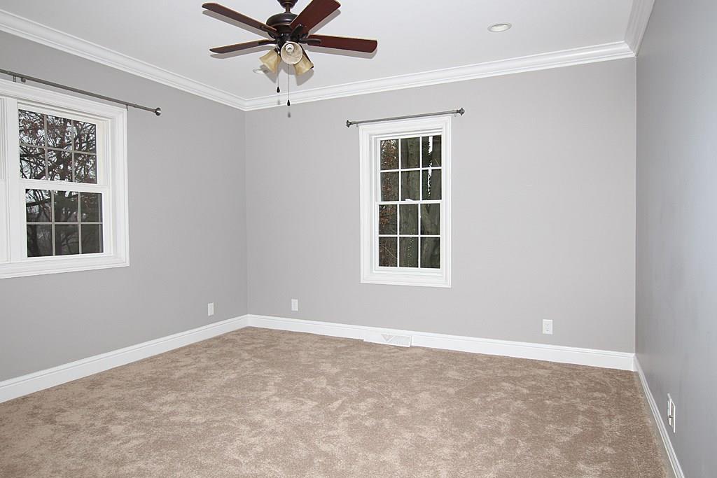 764 Osage Road Mt. Lebanon, PA 15243 - Photo 19 of 24 First floor bedroom with crown molding and recessed lighting and wall to wall carpet.