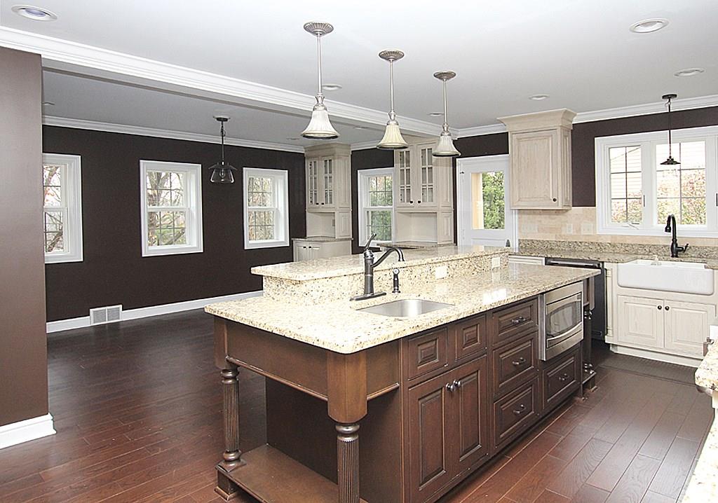 764 Osage Road Mt. Lebanon, PA 15243 - Photo 5 of 24 Center island kitchen with furniture quality cabinetry. Pendent lighting and porcelain farm sink. Crown molding and lots of windows make this home light and bright.