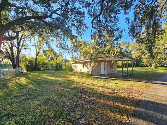 a house with trees in the background