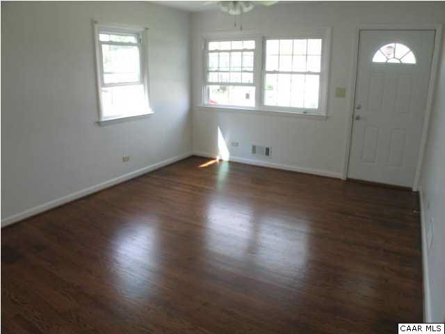 910 Rougemont Avenue Charlottesville, VA 22902 - Photo 17 of 21 Spacious Living Room with beutiful floors and lots of windows.