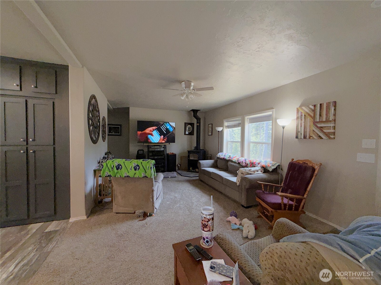 116 Cape Labelle Road Wauconda, WA 98859 - Photo 5 of 35 a living room with furniture and a table