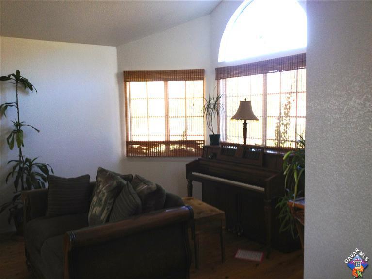 5115 Claro Way Palmdale, CA 93551 - Photo 2 of 7 a living room with furniture and a window