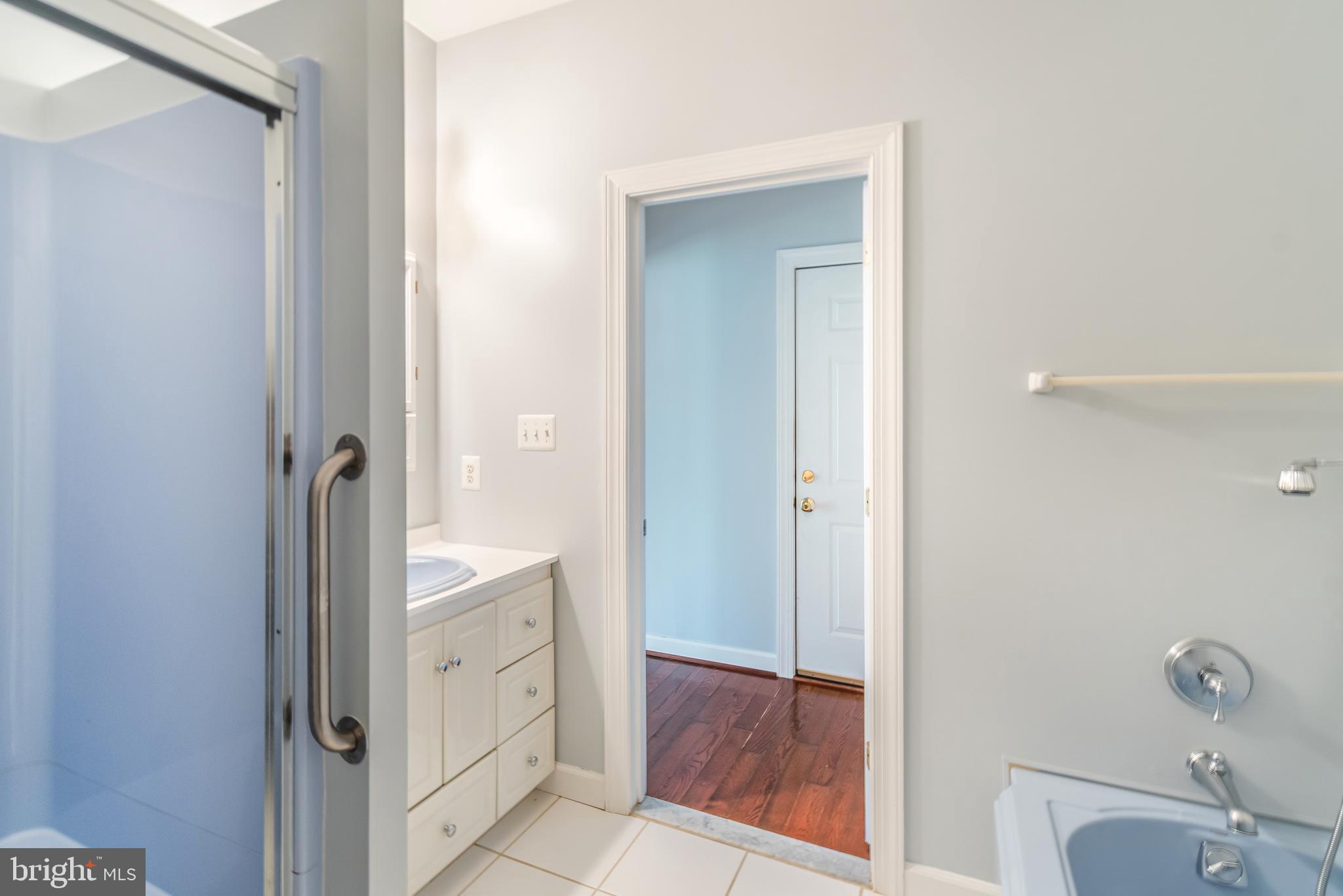 314 Colony Point Place Edgewater, MD 21037 - Photo 13 of 31 a spacious bathroom with a granite countertop sink toilet and shower