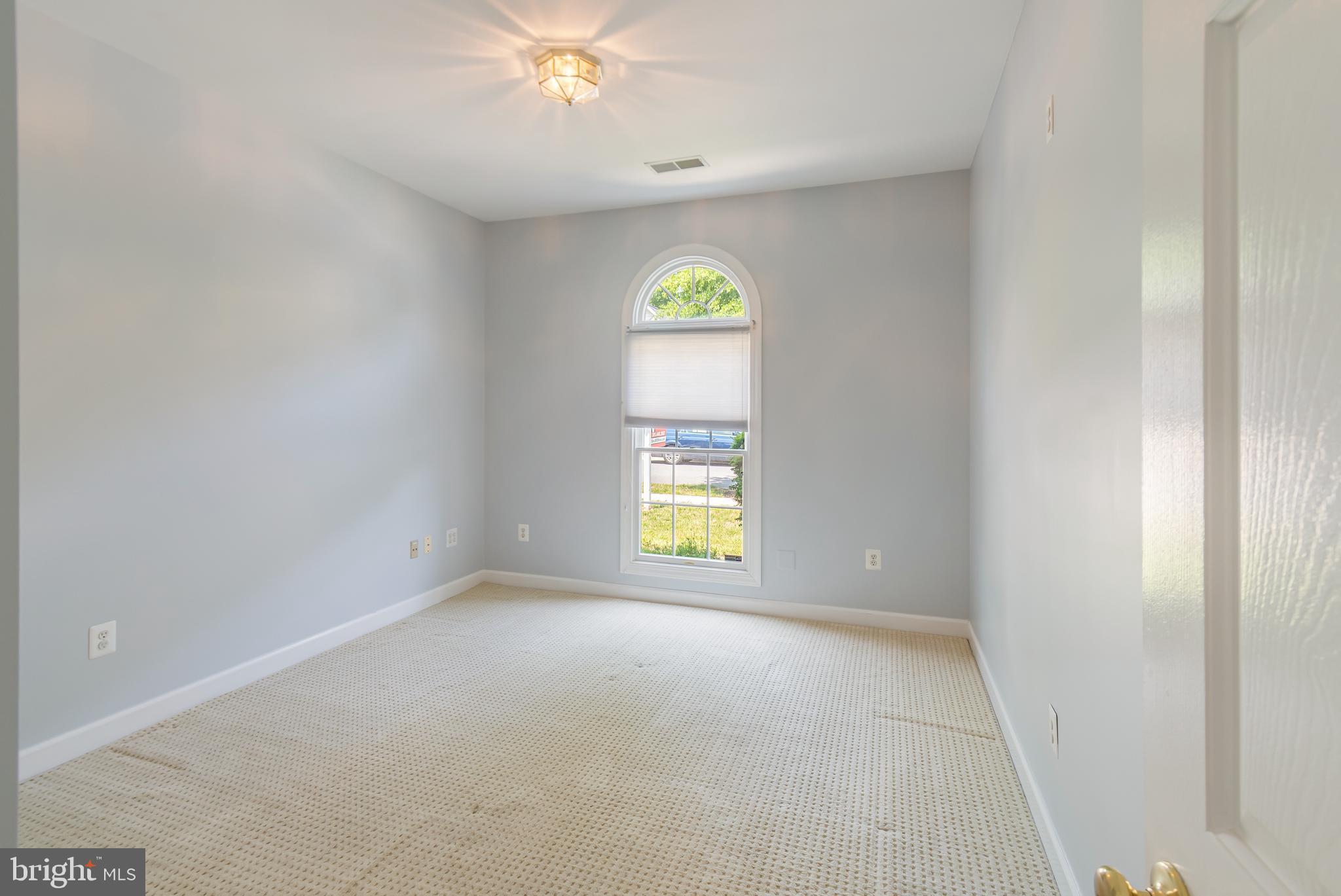 314 Colony Point Place Edgewater, MD 21037 - Photo 15 of 31 an empty room with windows and chandelier fan