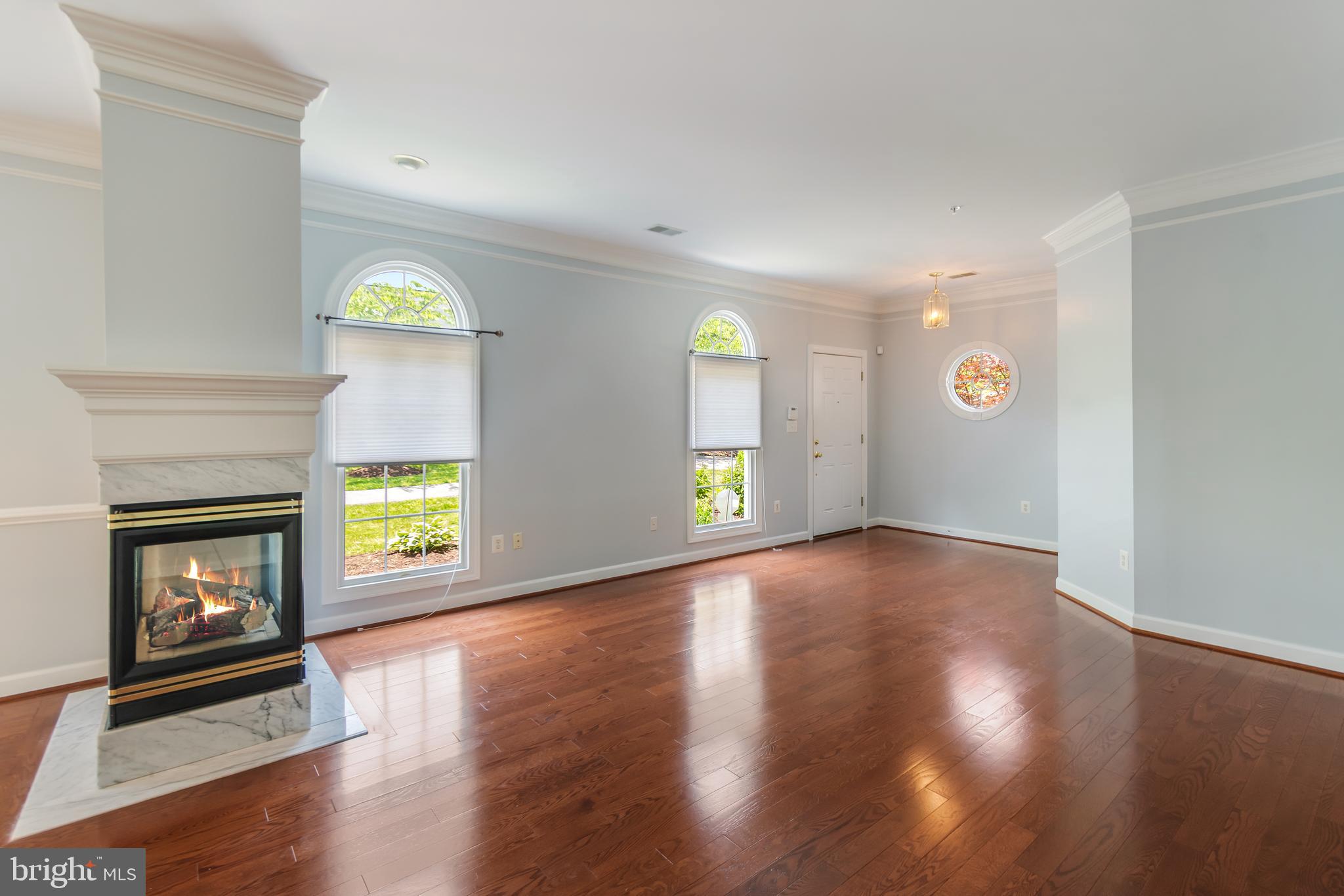 314 Colony Point Place Edgewater, MD 21037 - Photo 4 of 31 a view of an empty room with a fireplace and a window