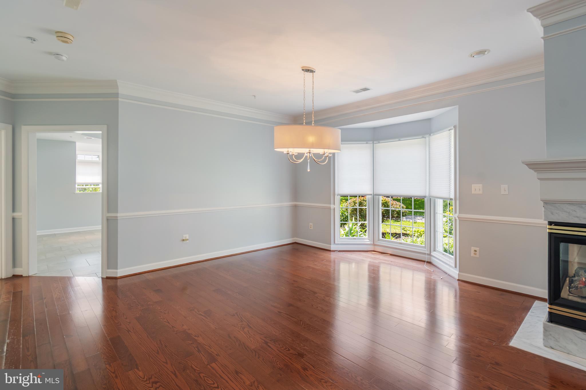 314 Colony Point Place Edgewater, MD 21037 - Photo 8 of 31 an empty room with wooden floor and windows