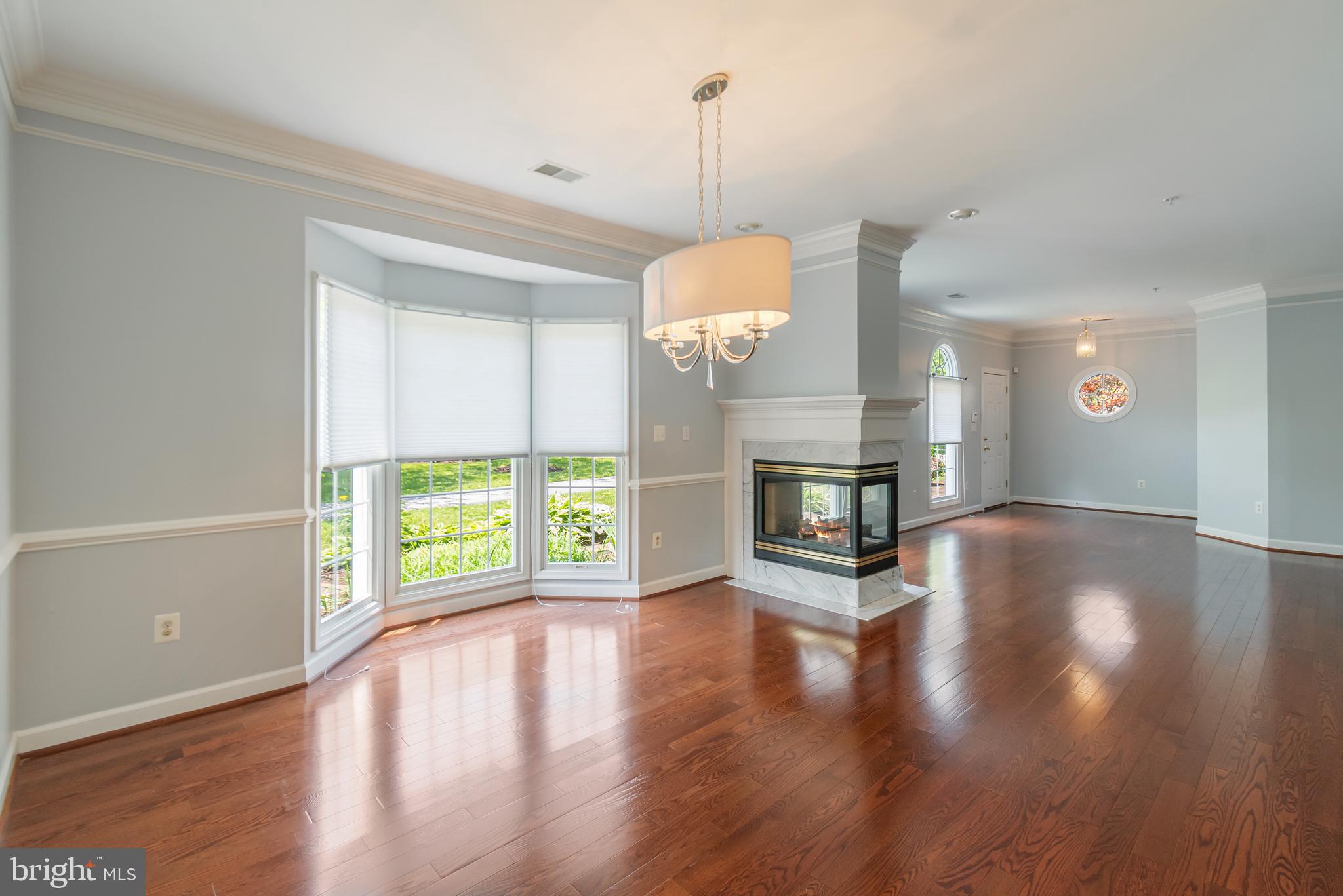 314 Colony Point Place Edgewater, MD 21037 - Photo 9 of 31 a view of a room with wooden floor and fireplace