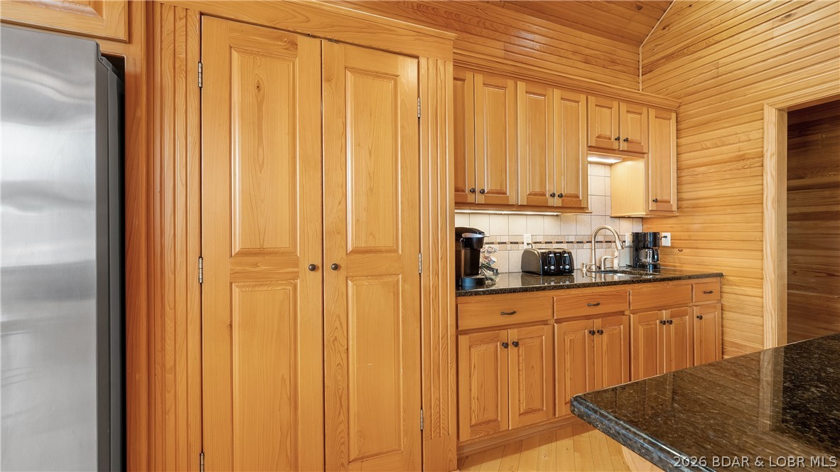 575 Graceland Point Climax Springs, MO 65324 - Photo 11 of 59 Cabinet doors open to a very large walk-through pa