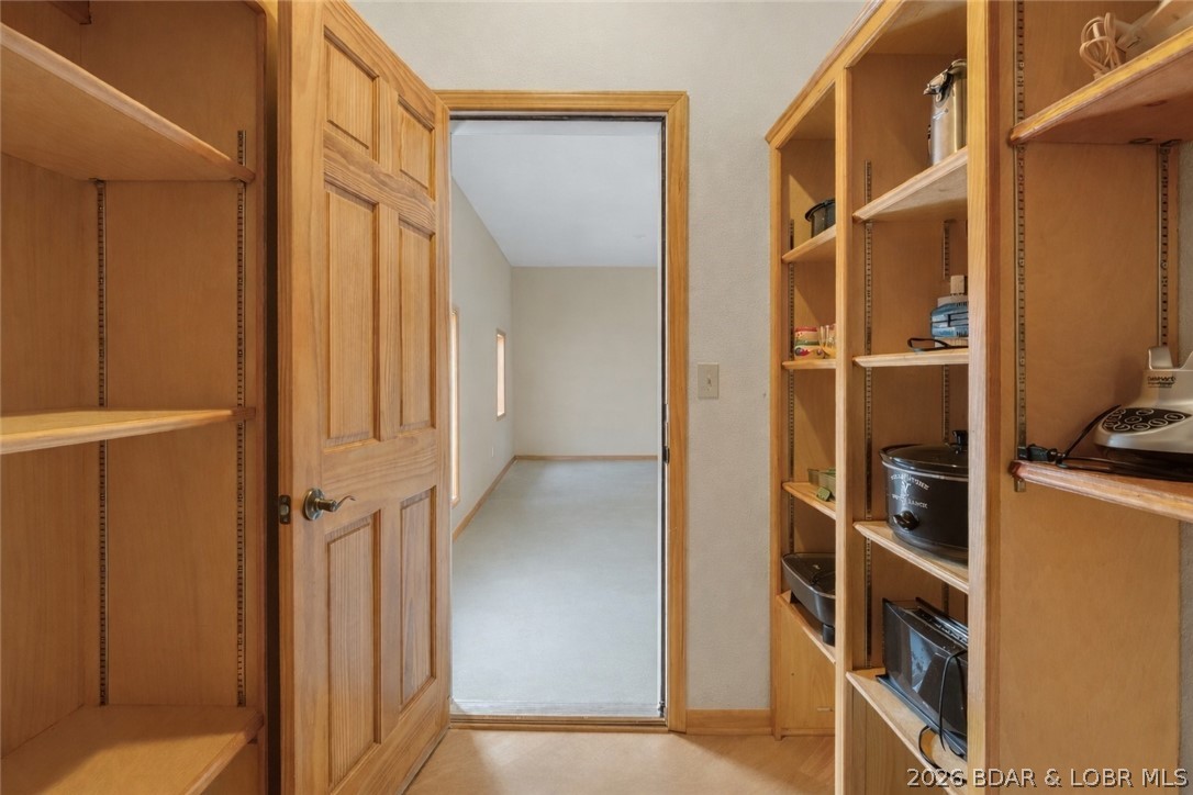 575 Graceland Point Climax Springs, MO 65324 - Photo 13 of 59 Enter pantry from garage for convenient unloading