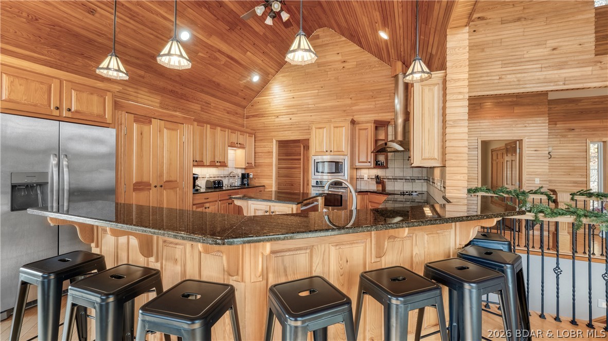 575 Graceland Point Climax Springs, MO 65324 - Photo 15 of 59 lots of additional dining seating at the kitchen c
