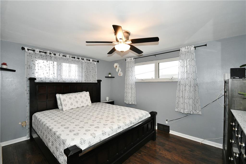 1619 Hollyrood Road Pittsburgh, PA 15227 - Photo 13 of 25 a bedroom with a bed and a chandelier