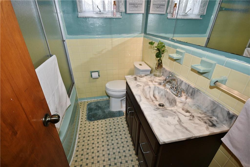 1619 Hollyrood Road Pittsburgh, PA 15227 - Photo 17 of 25 a bathroom with a sink and a toilet