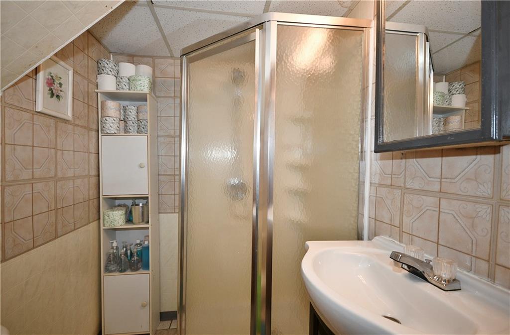 1619 Hollyrood Road Pittsburgh, PA 15227 - Photo 20 of 25 a bathroom with a shower and a sink