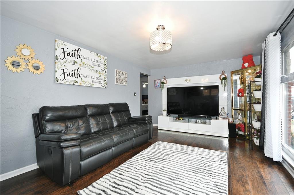 1619 Hollyrood Road Pittsburgh, PA 15227 - Photo 5 of 25 a living room with furniture and a flat screen tv