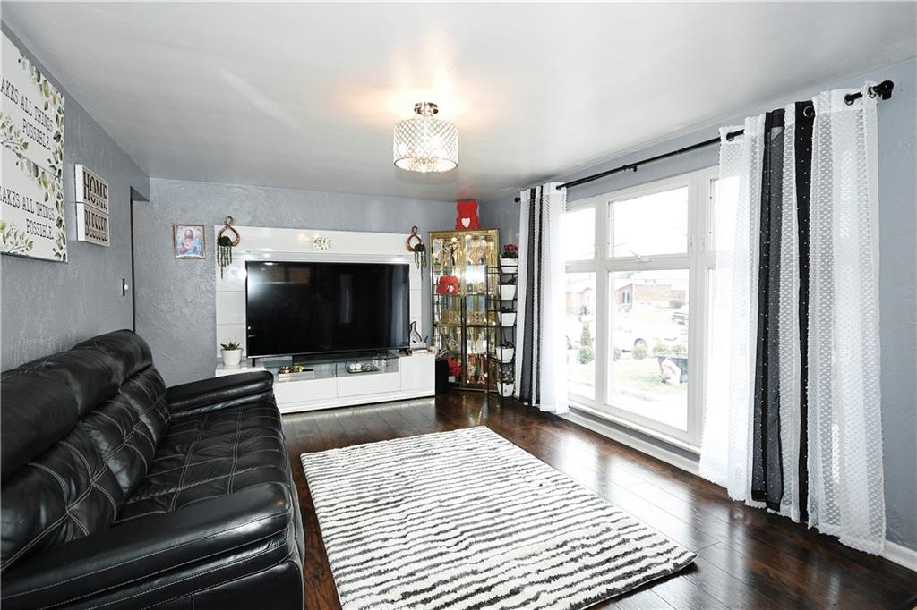 1619 Hollyrood Road Pittsburgh, PA 15227 - Photo 6 of 25 a living room with furniture and a flat screen tv