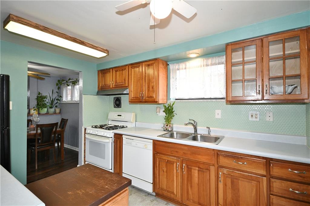 1619 Hollyrood Road Pittsburgh, PA 15227 - Photo 9 of 25 a kitchen with a sink cabinets and window
