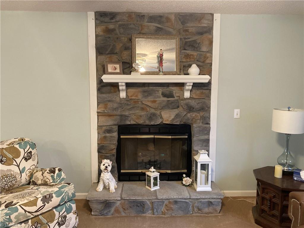 2811 Regal Road Reidsville, NC 27320 - Photo 9 of 19 Lovely rock fireplace with gas logs in Living Room