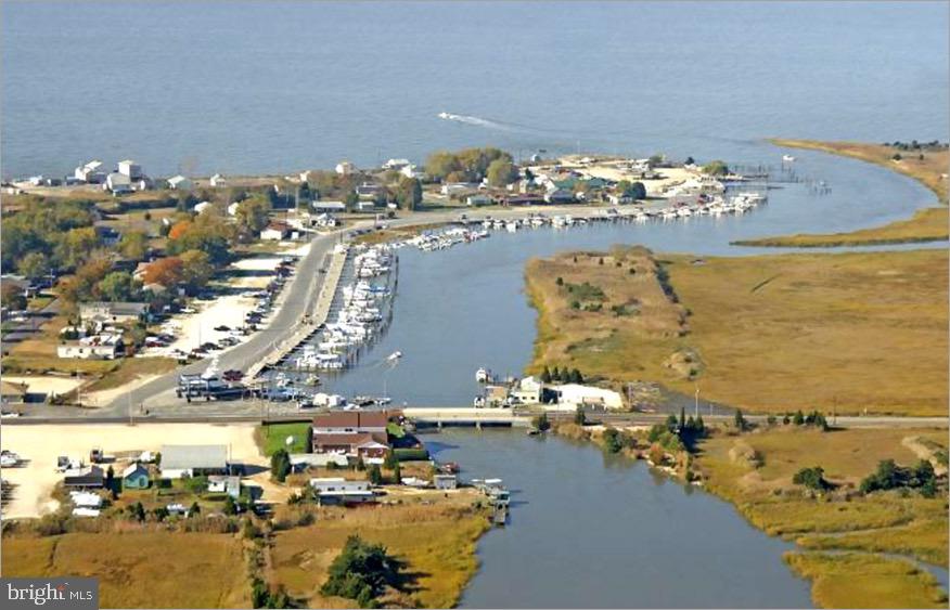 an aerial view of ocean and residential houses