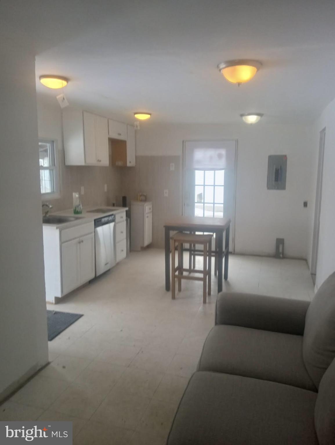 204 Bridgeton Avenue Fortescue, NJ 08321 - Photo 8 of 17 a living room with stainless steel appliances granite countertop furniture and a kitchen