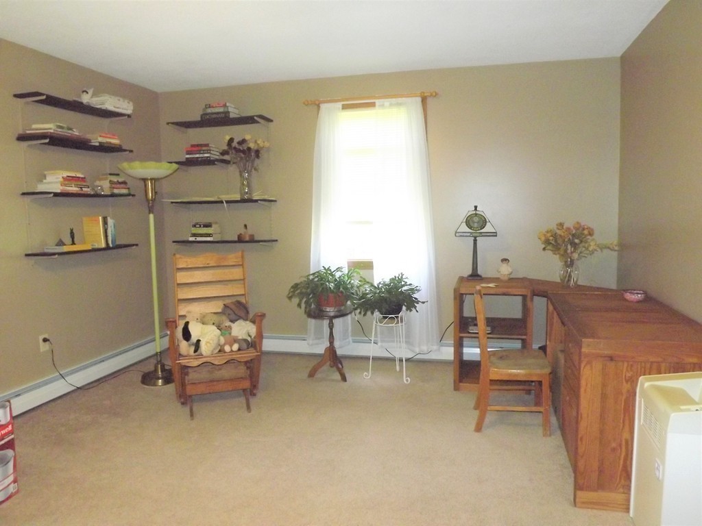 343 Cedar Swamp Road Monson, MA 01057 - Photo 11 of 24 a living room with furniture and a dining table