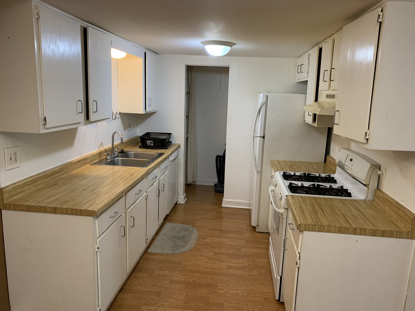528 East Bailey Road, Unit 102 Naperville, IL 60565 - Photo 2 of 8 a kitchen with a sink stove and refrigerator