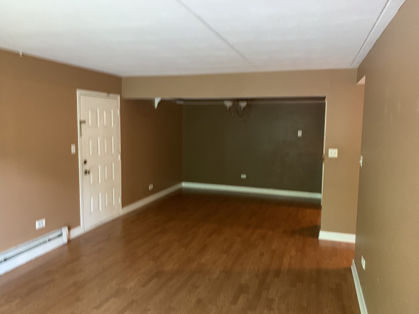 528 East Bailey Road, Unit 102 Naperville, IL 60565 - Photo 4 of 8 an empty room with wooden floor and windows