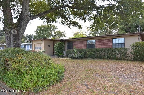6324 Anvil Road Jacksonville, FL 32277 - Photo 1 of 34 a front view of a house with a garden