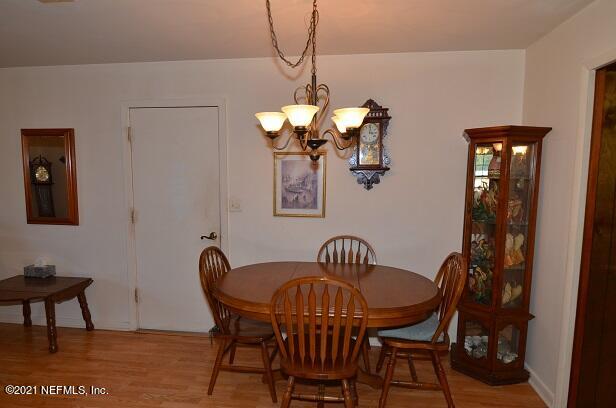 6324 Anvil Road Jacksonville, FL 32277 - Photo 13 of 34 a view of a dining room with furniture and chandelier