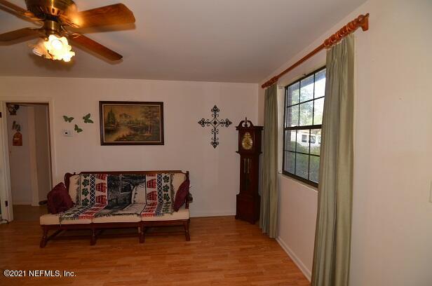 6324 Anvil Road Jacksonville, FL 32277 - Photo 6 of 34 a living room with furniture and a window