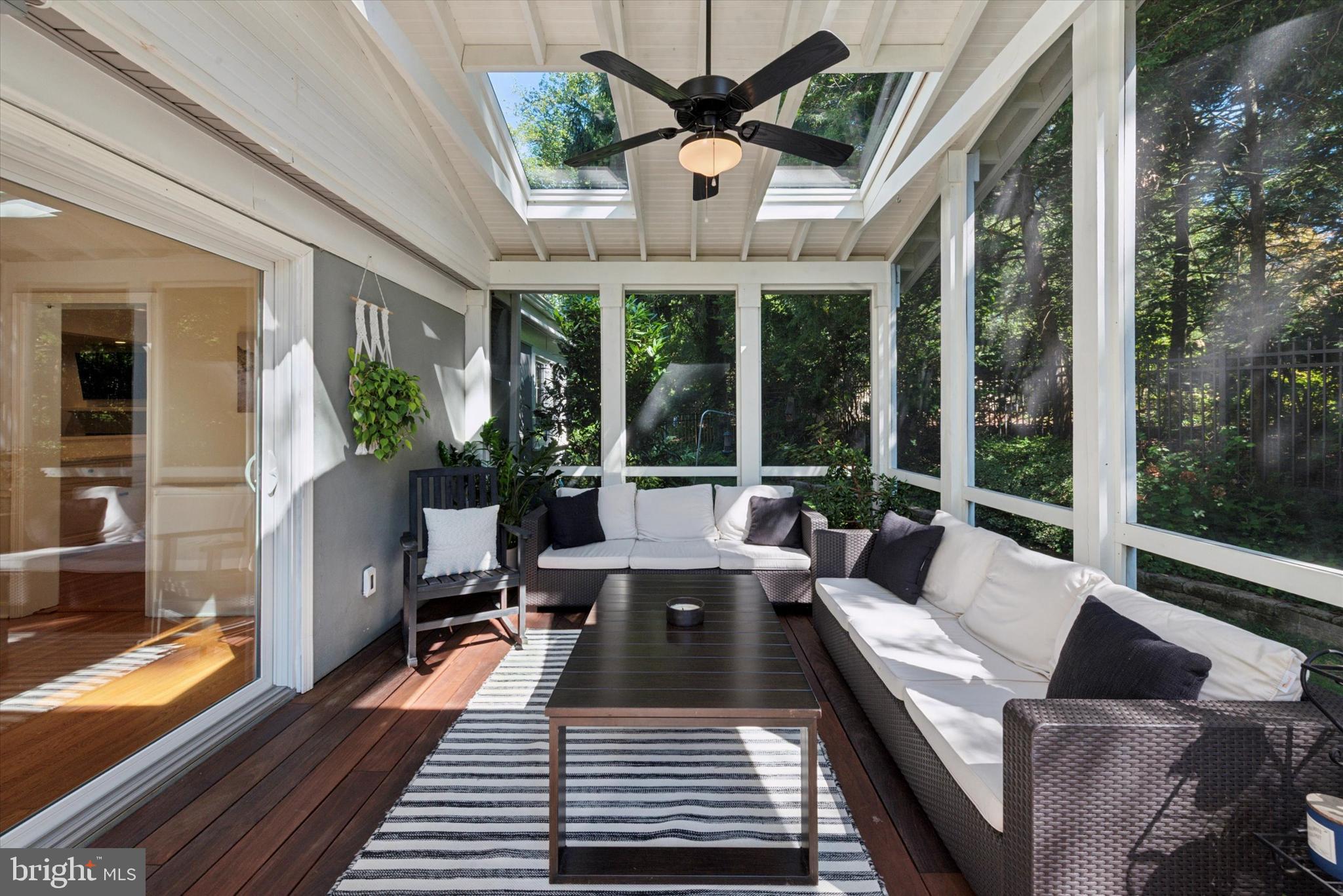 103 Deepdale Road Wayne, PA 19087 - Photo 13 of 41 a view of a patio with couches dining table and chairs with wooden floor