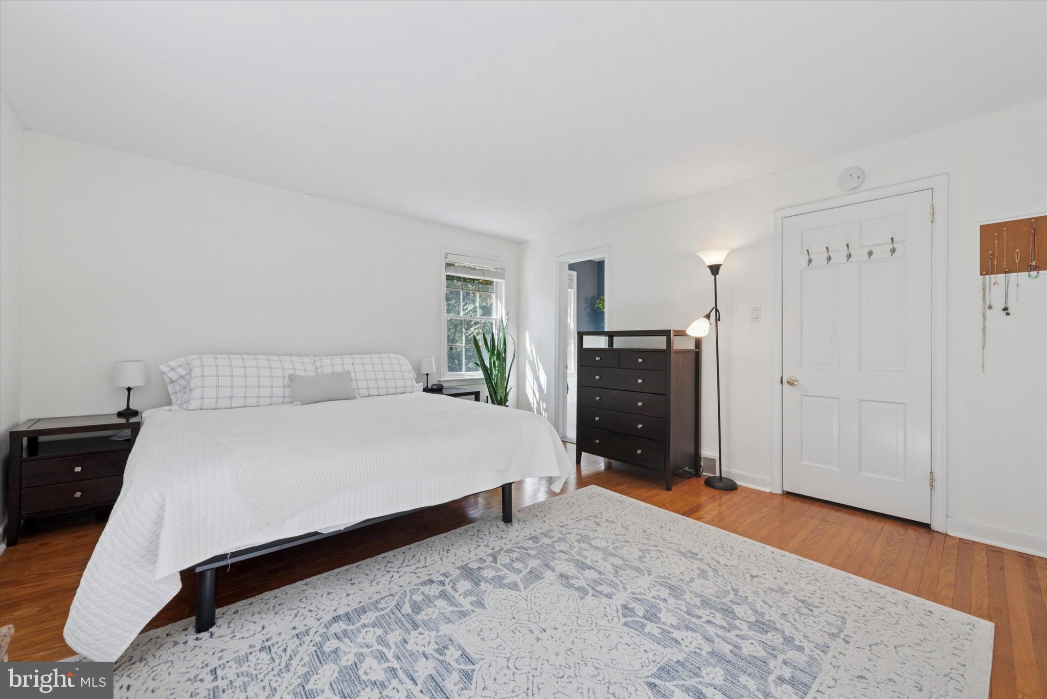 103 Deepdale Road Wayne, PA 19087 - Photo 14 of 41 a bed room with a bed and wooden floor