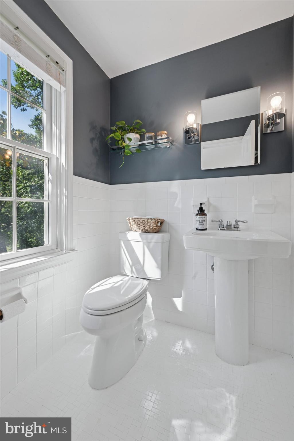 103 Deepdale Road Wayne, PA 19087 - Photo 16 of 41 a white toilet sitting next to a bathroom sink