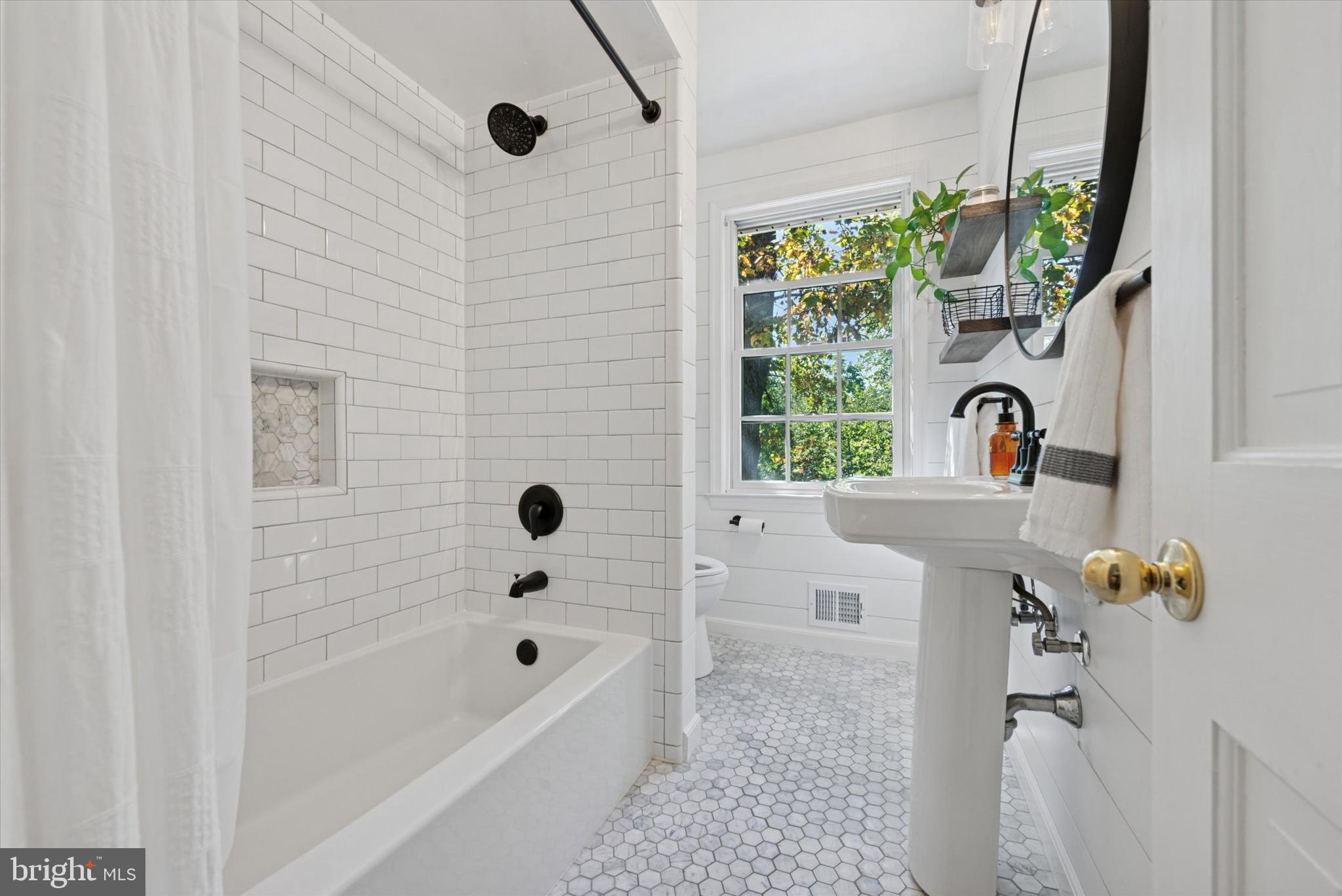 103 Deepdale Road Wayne, PA 19087 - Photo 19 of 41 a bathroom with a tub sink and window