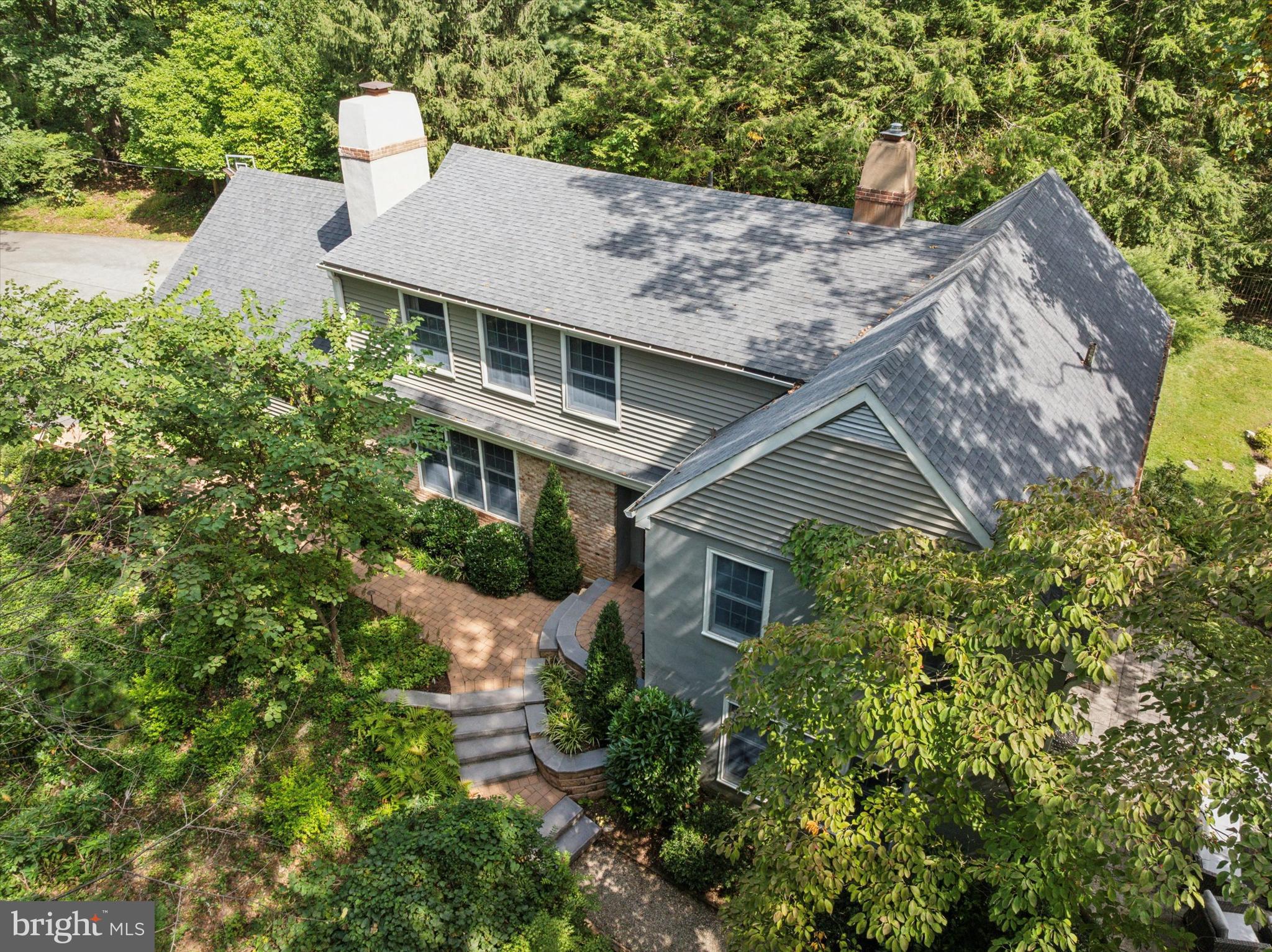 103 Deepdale Road Wayne, PA 19087 - Photo 2 of 41 a aerial view of a house with yard and trees in the background