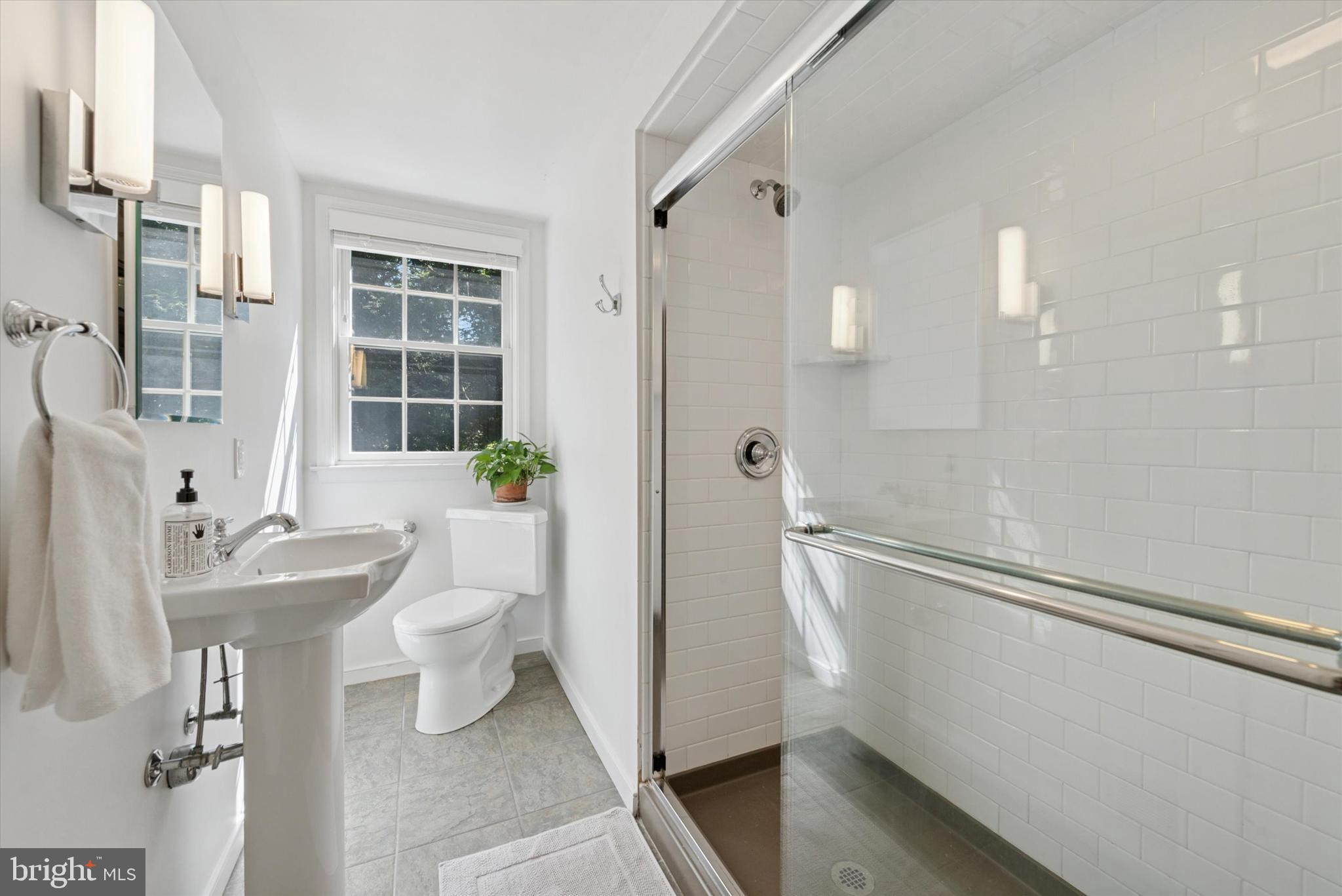 103 Deepdale Road Wayne, PA 19087 - Photo 24 of 41 a bathroom with a sink a toilet and shower