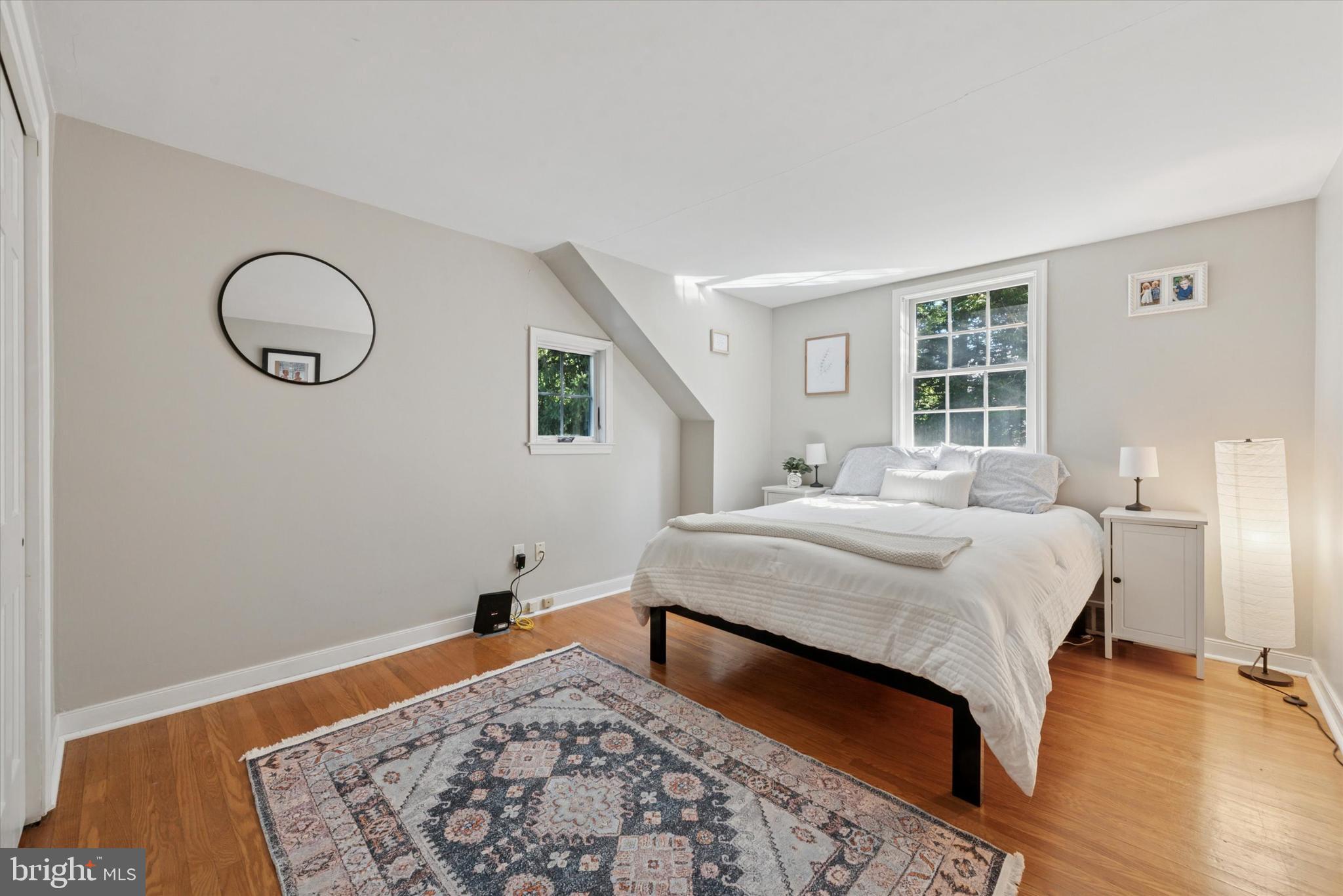 103 Deepdale Road Wayne, PA 19087 - Photo 25 of 41 a bedroom with a bed and wooden floor