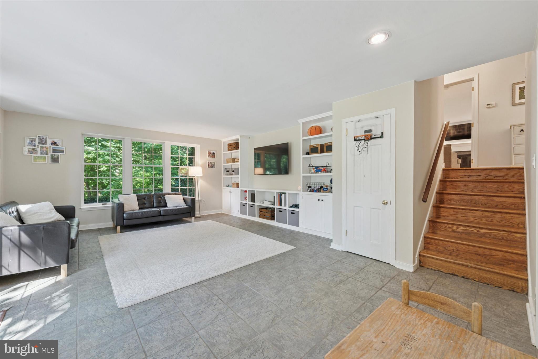 103 Deepdale Road Wayne, PA 19087 - Photo 27 of 41 a living room with furniture large window and flat screen tv