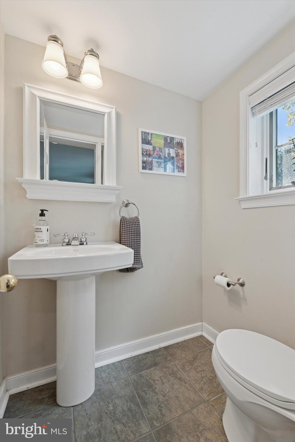 103 Deepdale Road Wayne, PA 19087 - Photo 29 of 41 a bathroom with a sink toilet and mirror