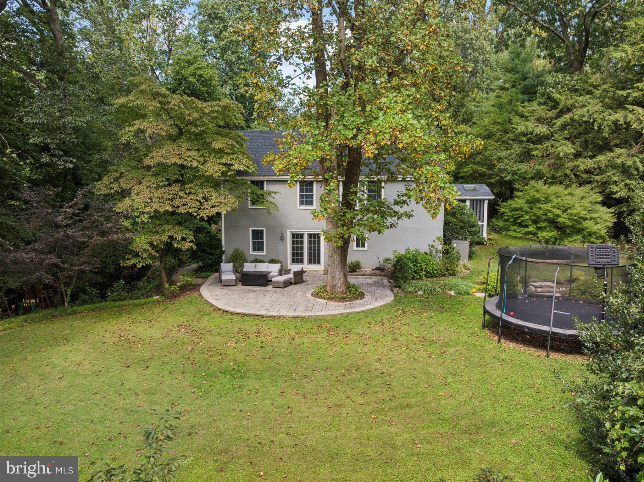 103 Deepdale Road Wayne, PA 19087 - Photo 33 of 41 a view of a backyard with table and chairs and potted plants