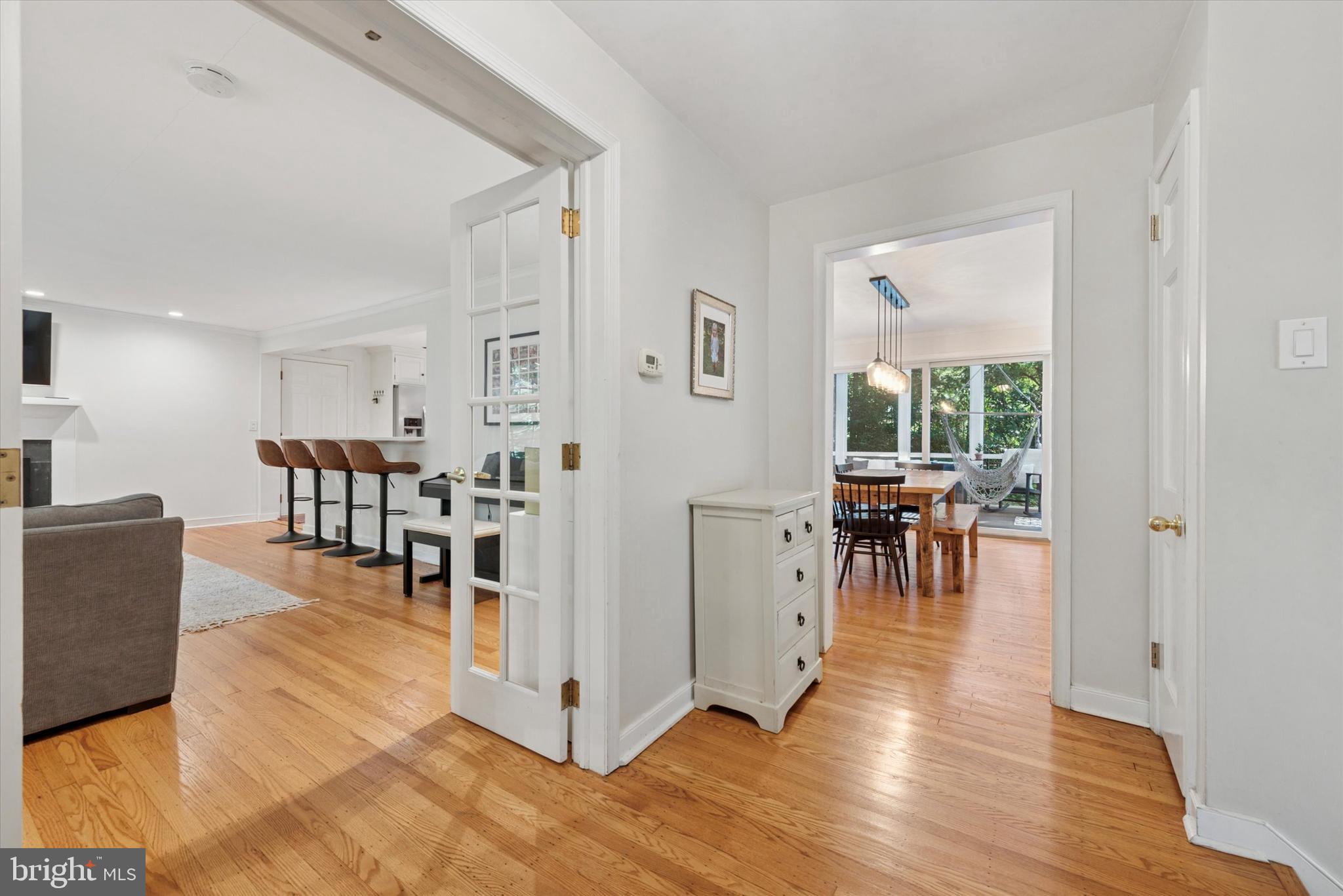 103 Deepdale Road Wayne, PA 19087 - Photo 5 of 41 a living room with furniture and a dining table with wooden floor