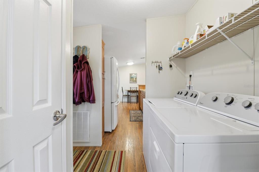 7305 South Threshold Point Homosassa, FL 34446 - Photo 14 of 46 a walk in closet with wooden floor