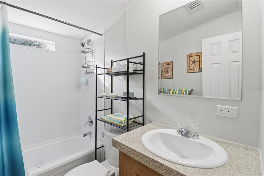 7305 South Threshold Point Homosassa, FL 34446 - Photo 17 of 46 a bathroom with a sink toilet and shower