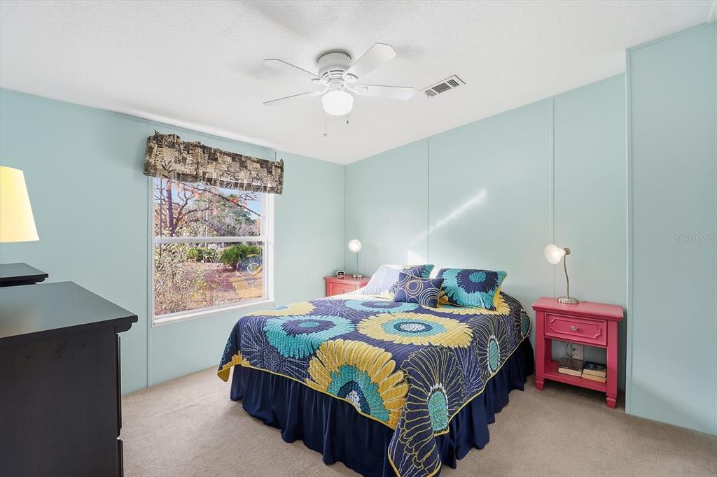 7305 South Threshold Point Homosassa, FL 34446 - Photo 21 of 46 a bedroom with a bed and a window