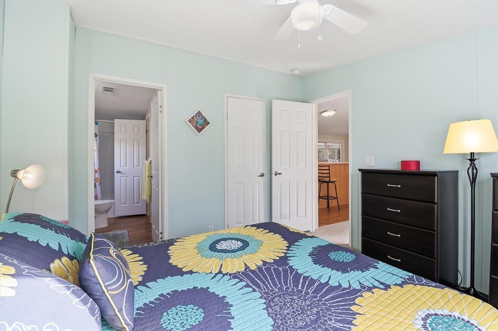 7305 South Threshold Point Homosassa, FL 34446 - Photo 22 of 46 a bedroom with a bed and a lamp
