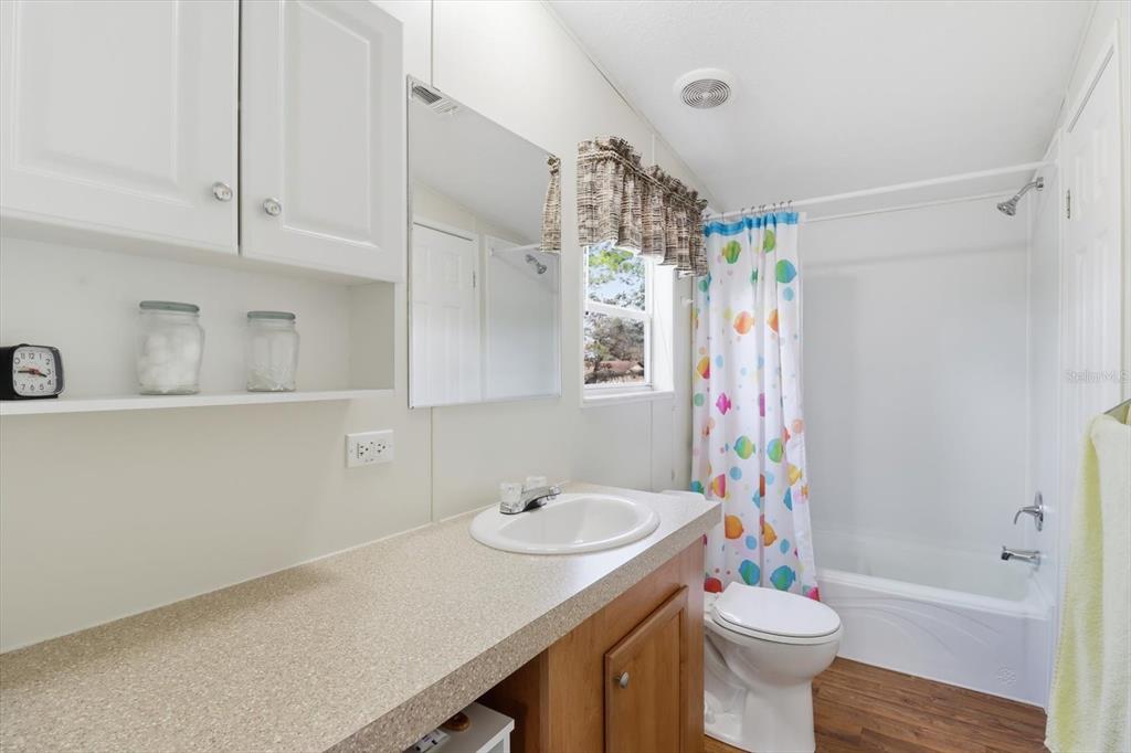 7305 South Threshold Point Homosassa, FL 34446 - Photo 23 of 46 a bathroom with a sink toilet and shower