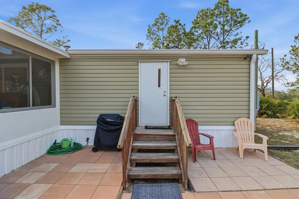 7305 South Threshold Point Homosassa, FL 34446 - Photo 30 of 46 a view of a chairs in a patio