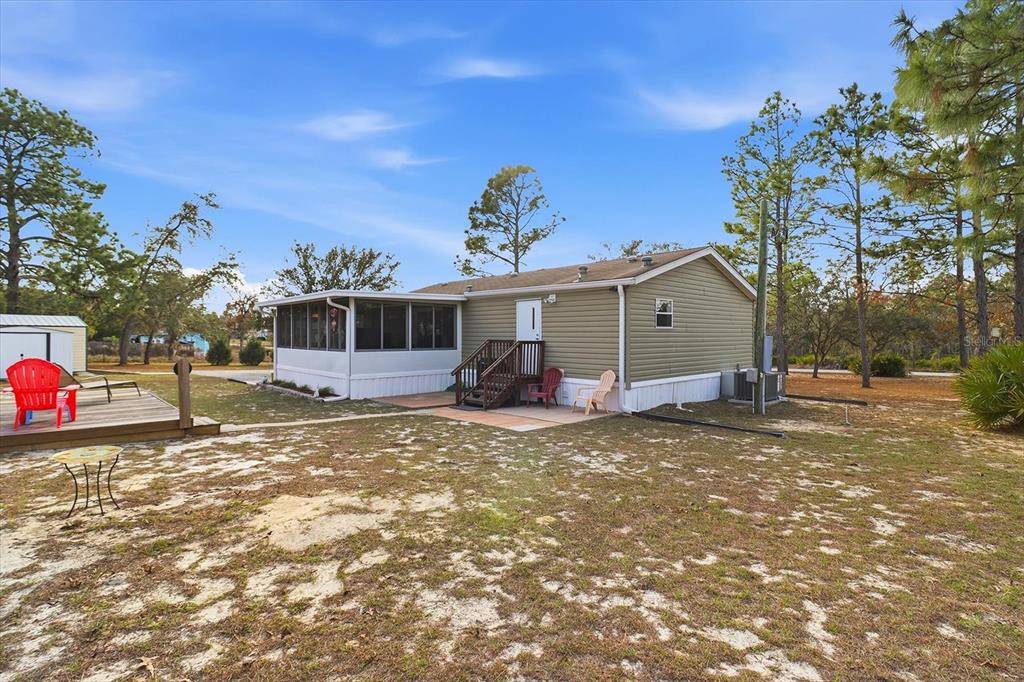 7305 South Threshold Point Homosassa, FL 34446 - Photo 32 of 46 a view of a house with a patio