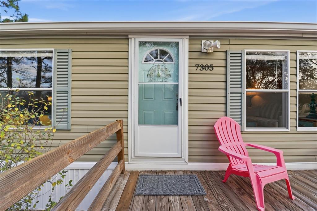 7305 South Threshold Point Homosassa, FL 34446 - Photo 39 of 46 a balcony with furniture and a potted plant