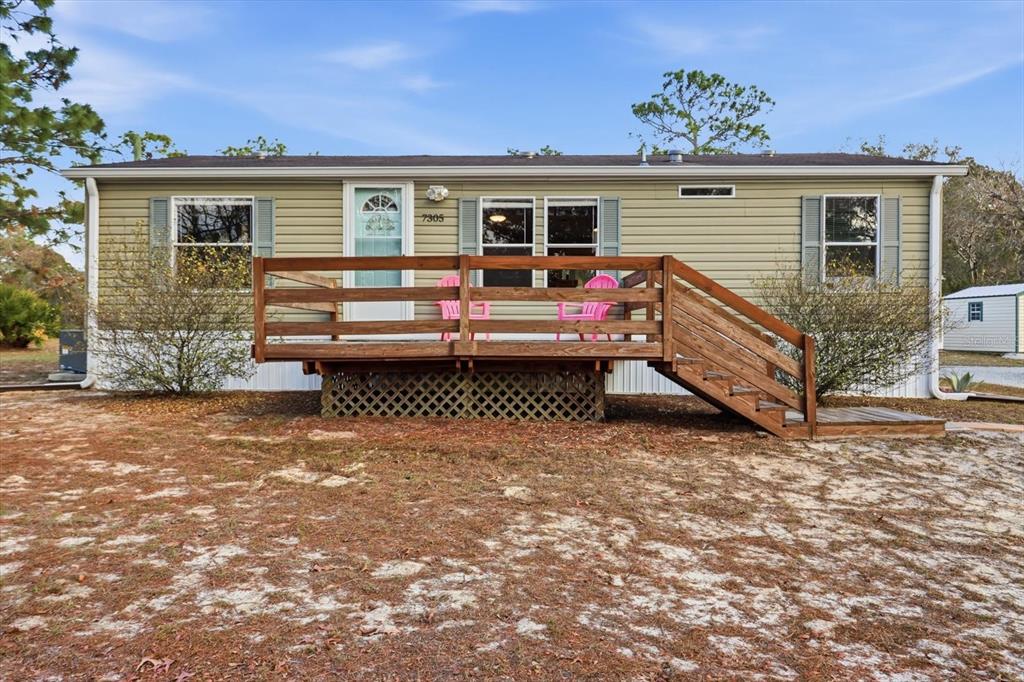 7305 South Threshold Point Homosassa, FL 34446 - Photo 40 of 46 a view of a house with a yard