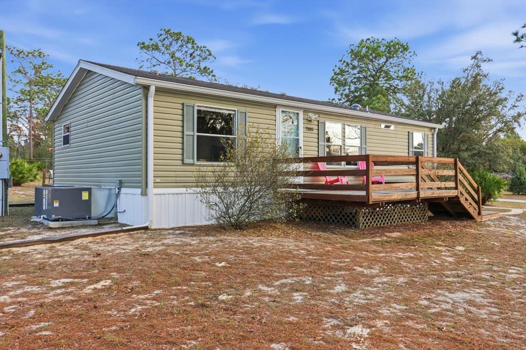 7305 South Threshold Point Homosassa, FL 34446 - Photo 41 of 46 a front view of a house with a garage